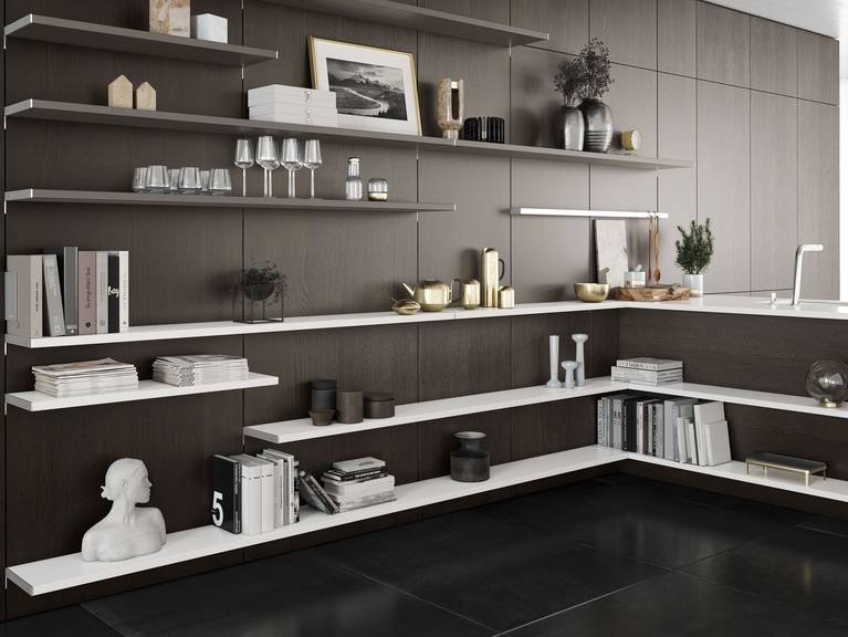 A visual connection between living, dining and kitchen areas thanks to the flexible wall panel system SieMatic FloatingSpaces