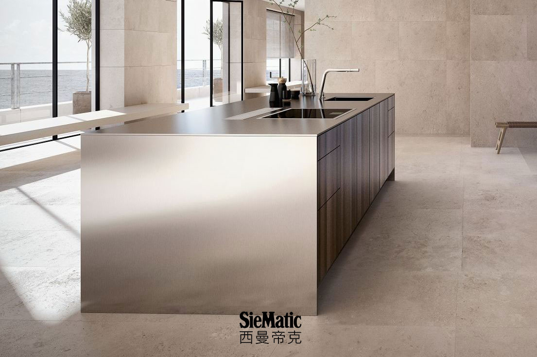 SieMatic Pure SE kitchen island in smoked oak veneer with countertop and side panels that appear 1 cm thick in stainless steel