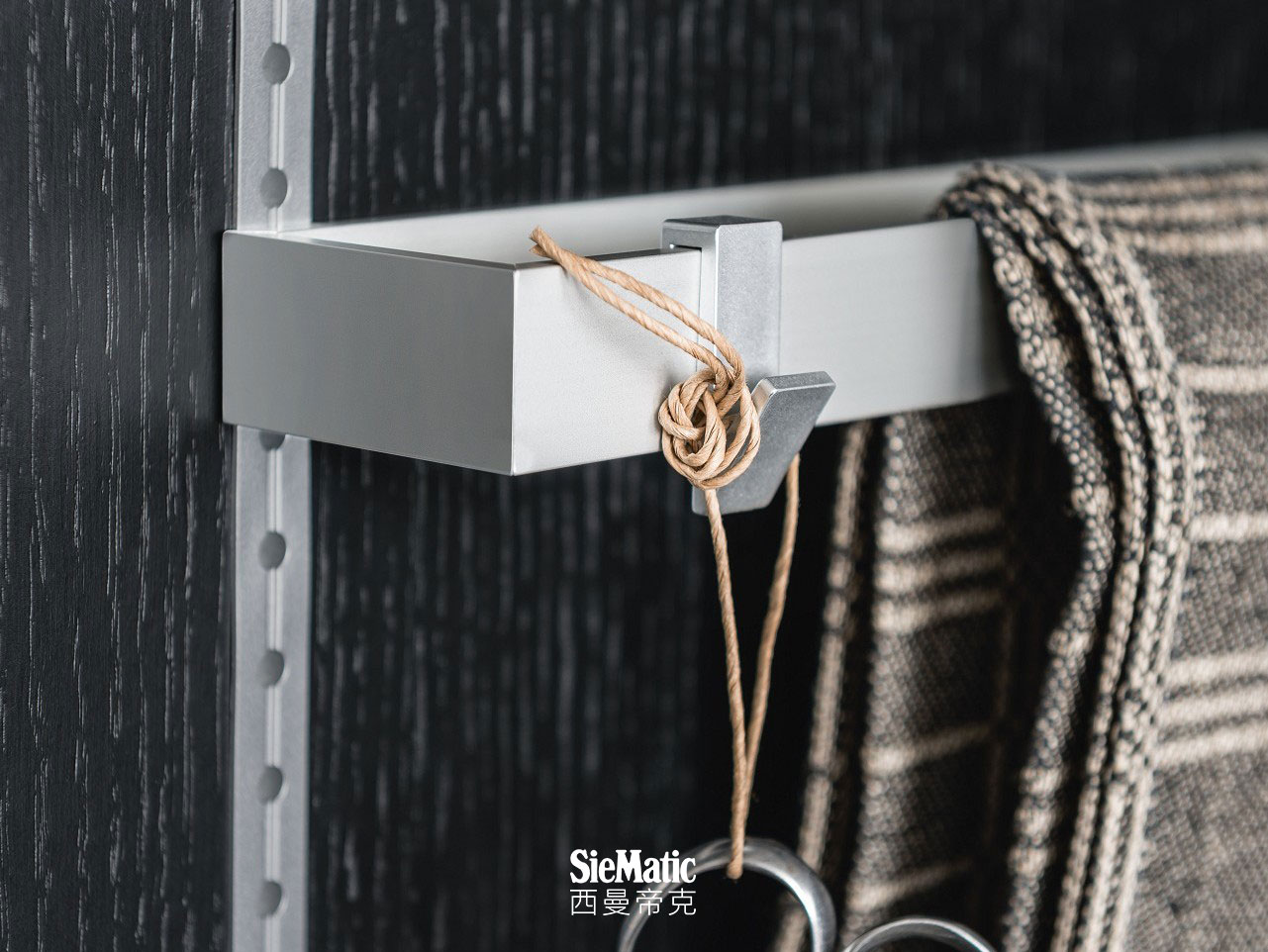 Dishcloth rack and hooks from the SieMatic MultiMatic interior organization system for kitchen cabinet doors